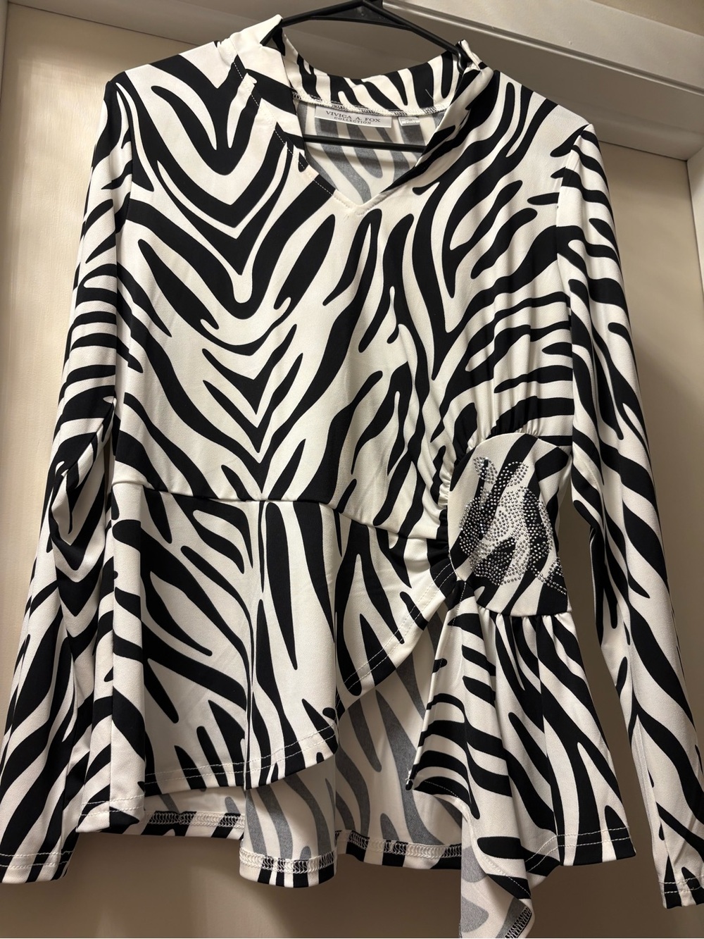 Black & White Zebra Print Peplum Long-Sleeve Top - Women